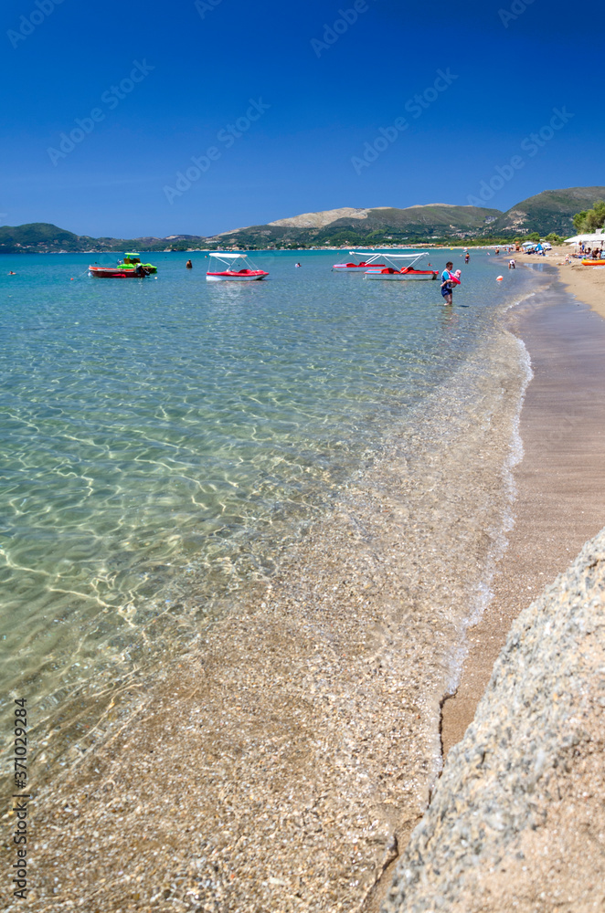 Picturesque golden sandy beach in Kalamaki situated on Laganas bay of Zakynthos island on Ionian Sea, Greece.
