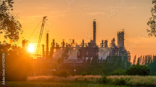 Oil refinery and​ industrial​ city​ After sunset  © Pugun & Photo Studio