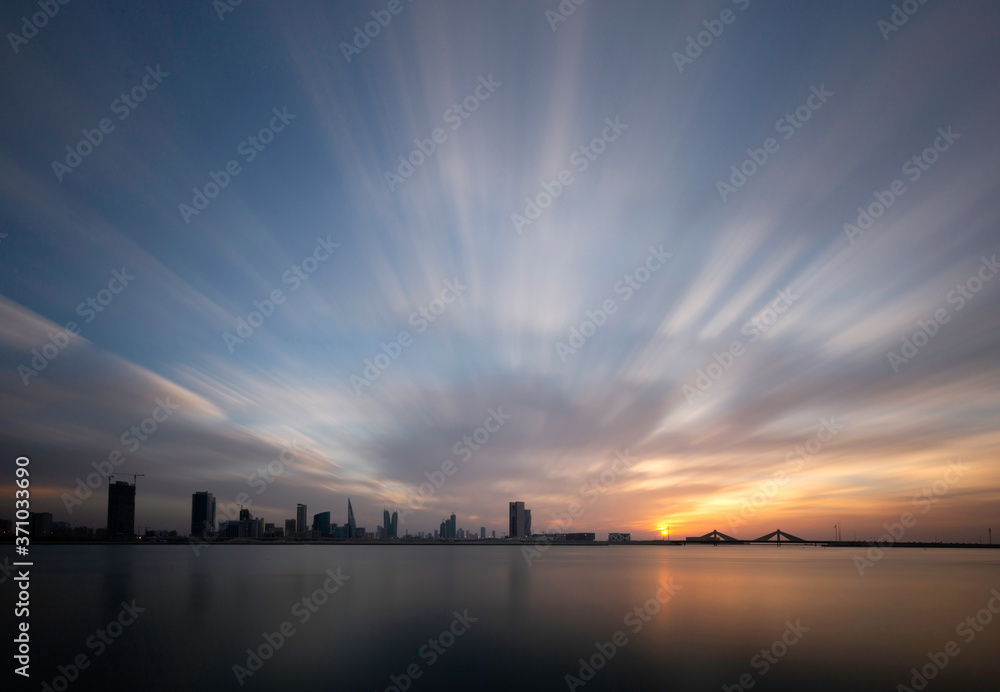 Fototapeta premium Dramatic clouds and Bahrain skyline at dusk