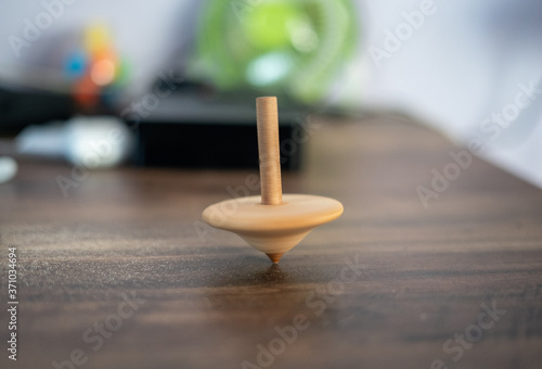 Motion blur of spinner rotating on table