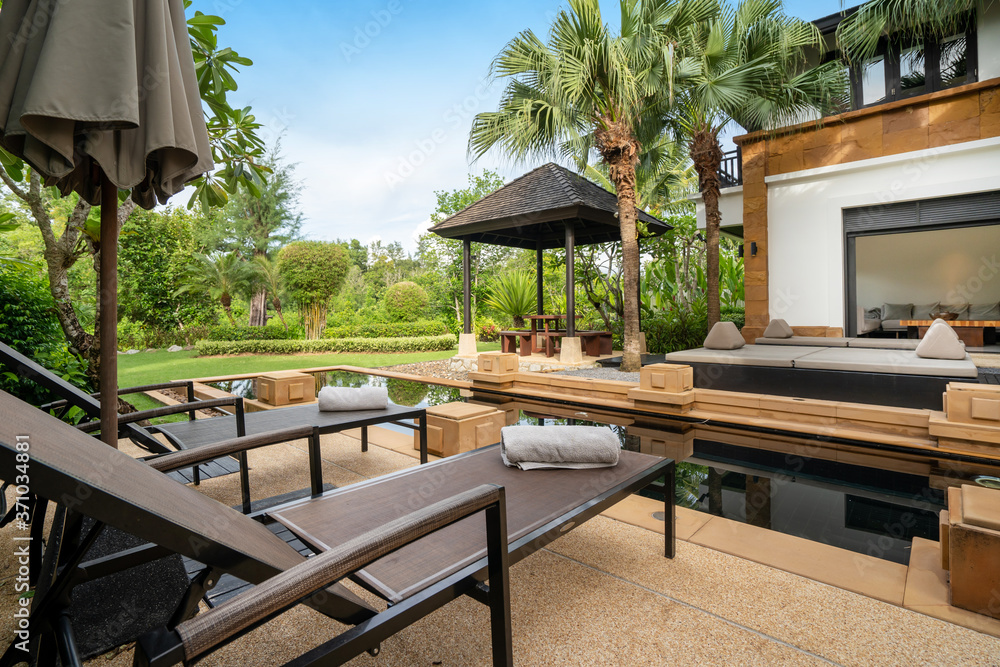 Φωτογραφία Exterior design of house, home and villa feature swimming pool, sun bed, umbrell