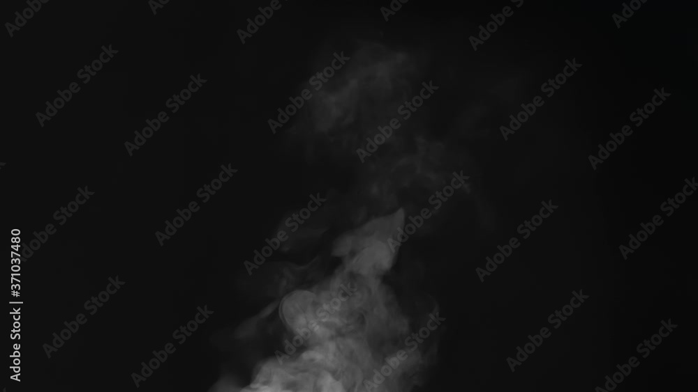Steam Flow Deviates to the Rright. White Steam rises from a large pot that is behind the scenes. Black background. Filmed at a speed of 240fps Steam Flow Deviates to the Rright. White Steam rises from a large pot that is behind the scenes. Black background. Filmed at a speed of 240fps