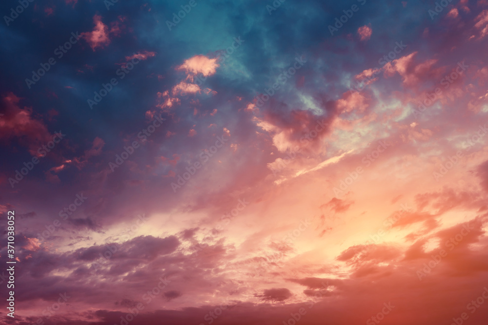 Colorful and peaceful sunset with red-tinted clouds. Sky Background or texture