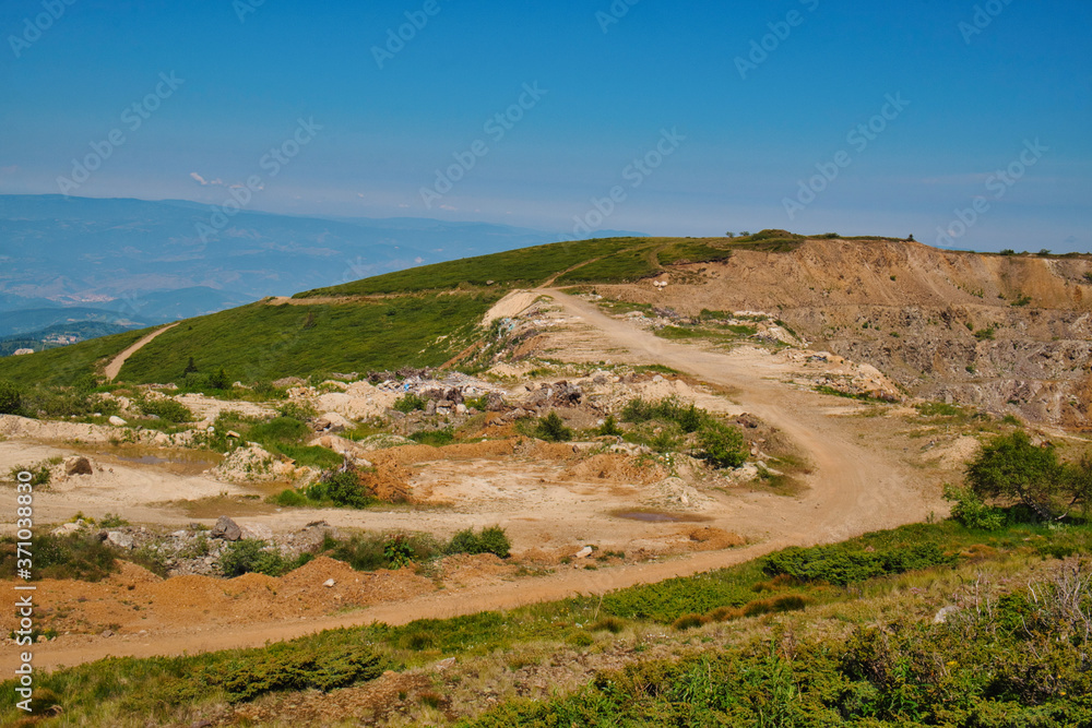 Large limestone quarry in Kopaonik mountains on the border between Koso and Serbia Large limestone quarry in Kopaonik mountains on the border between Koso and Serbia