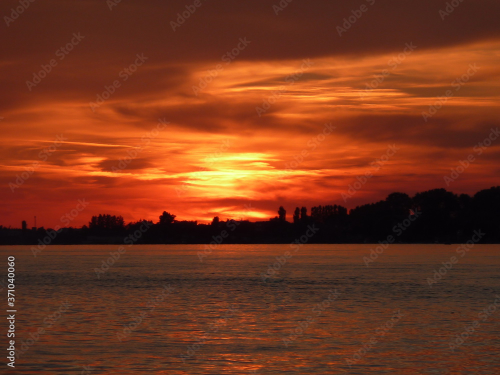 Sunset with colorful sky and clouds on the river Danube in Novi Sad, Serbia
