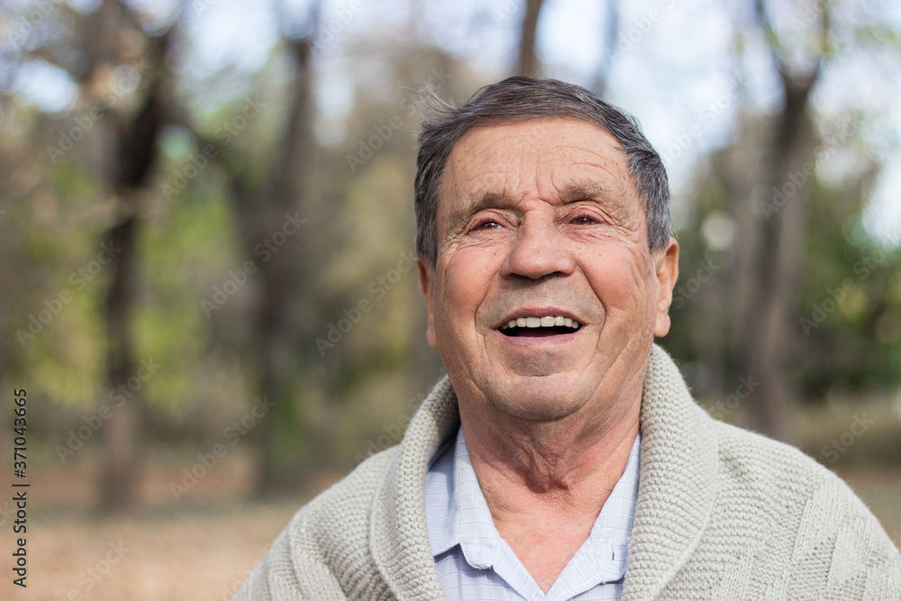 Portrait of happy senior man. Portrait of elderly man enjoying retirement Portrait of happy senior man. Portrait of elderly man enjoying retirement