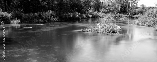 Long exposure water smoothing on an English chalk river. Chilton Foliat in Berkshire. photo