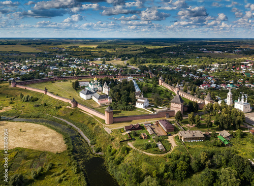 Panoramic aerial view of ancient city Suzdal and Saviour Monastery of St. Euthymius at sunny day. Golden ring of Russia, Vladimir region. Aerial drone photo.