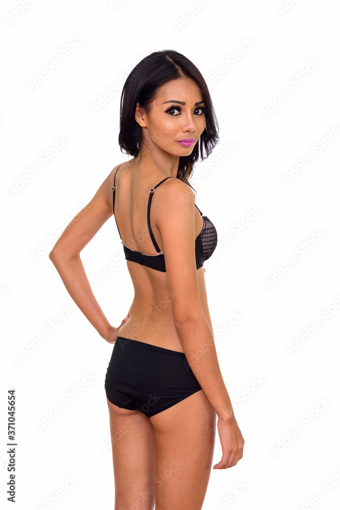 Studio shot of sexy Asian woman wearing underwear isolated against white background Studio shot of sexy Asian woman wearing underwear isolated against white background