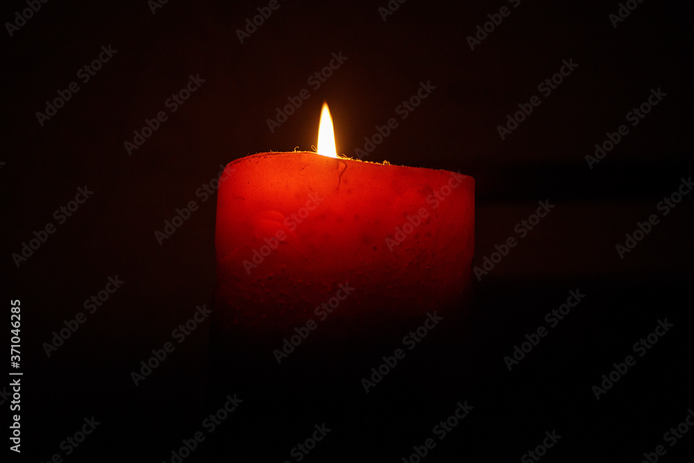 Burning candle on black background, isolated. Burning candle on black background, isolated.