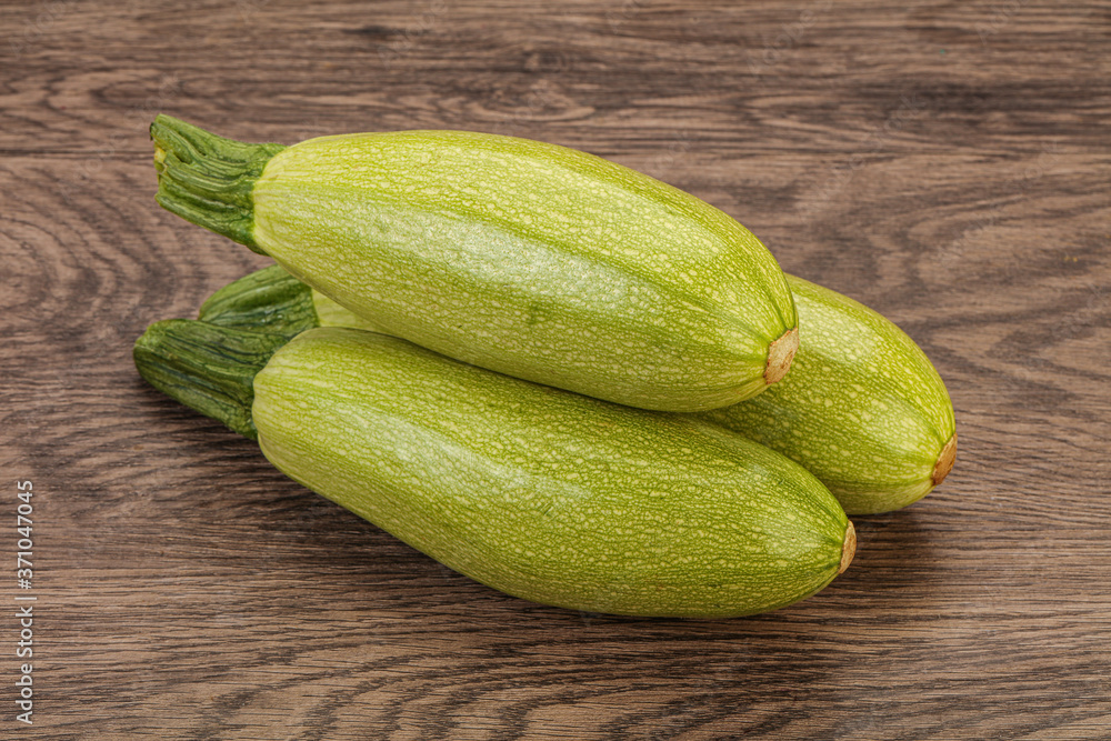 Young tasty zucchini over board Young tasty zucchini over board