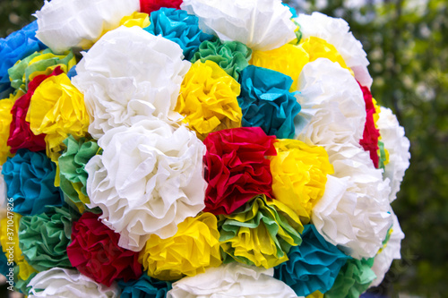 Abstract background of the flowers of colored paper closeup shot. origami ball paper figure. Sperical modular origami object. Close up  origami ball isolated on white background. Japanese artwork  photo