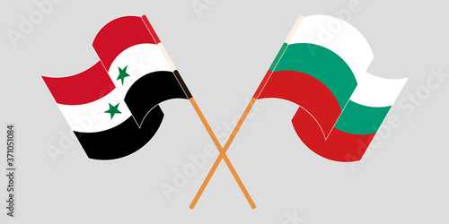 Crossed and waving flags of Syria and Bulgaria