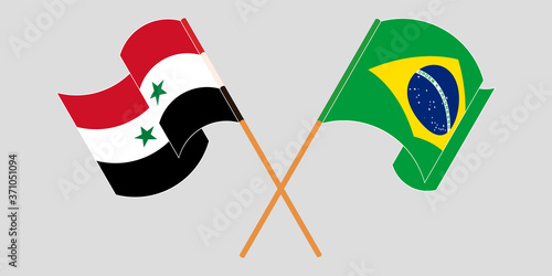 Crossed and waving flags of Syria and Brazil