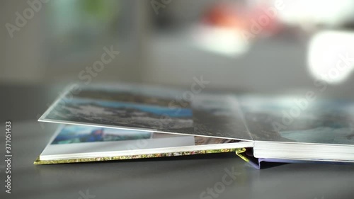 Wallpaper Mural open photo book on a gray background Torontodigital.ca