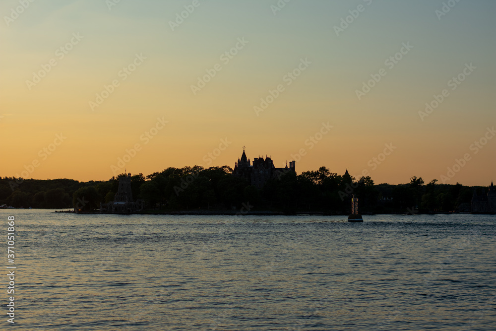 Fototapeta premium Sunset over the castle on the river
