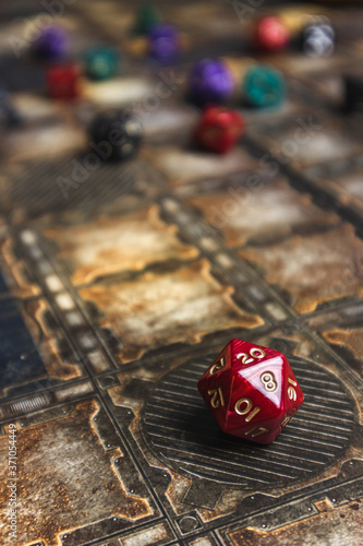 Red d20 die showhing a 20. Role playing dice. Dungeons and Dragons style dice.