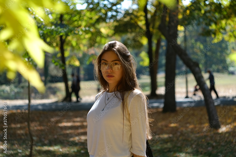 young woman in the park in autumn