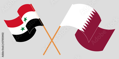 Crossed and waving flags of Syria and Qatar