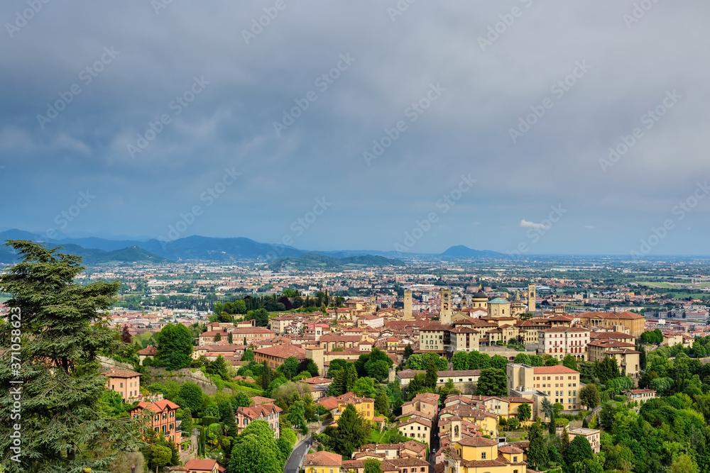View of the city of Bergamo and its central historical part from the height of the observation deck of the castle of Di San Vigilio. Castle di San Vigilio is a public place