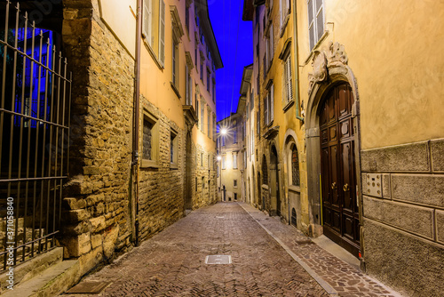Night view of the medieval streets in the historical center of Bergamo, Italy