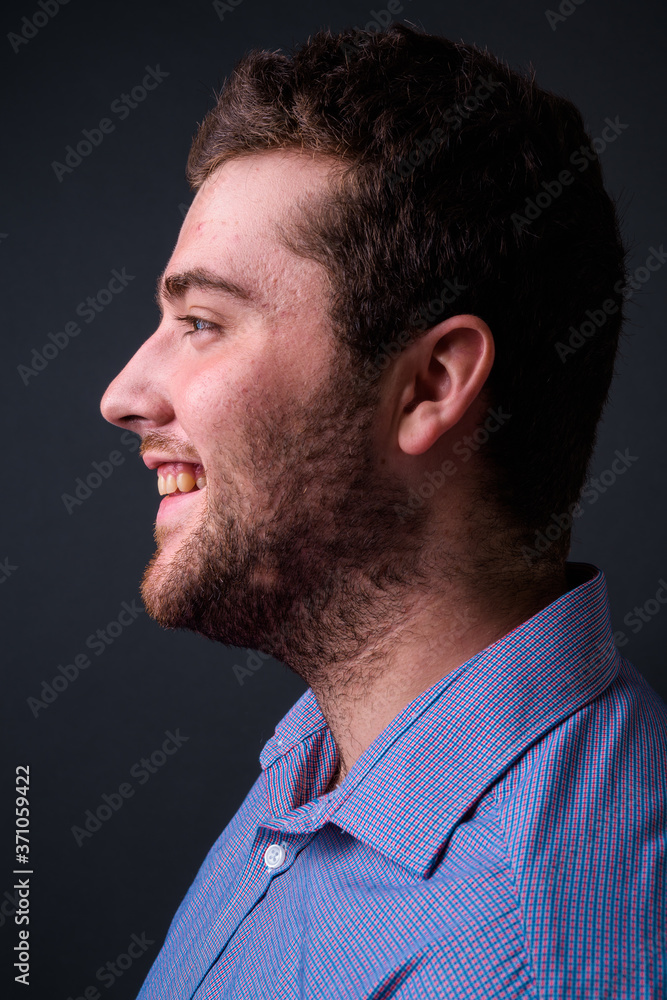 Portrait of happy young handsome overweight bearded businessman Portrait of happy young handsome overweight bearded businessman