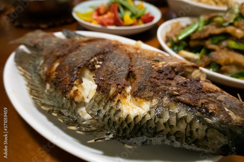 sauteed fish on the table photo