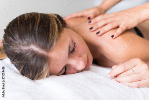 Woman having a massage in a spa