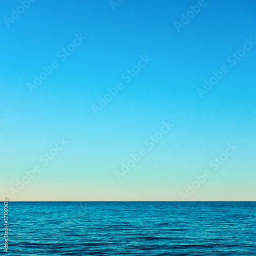 Sea horizon and serene blue sky