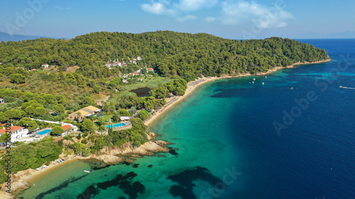 Fototapeta Naklejka Na Ścianę i Meble -  Aerial drone photo of popular paradise turquoise beach of Vromolimnos with small swamp next to it, Skiathos island, Sporades, Greece