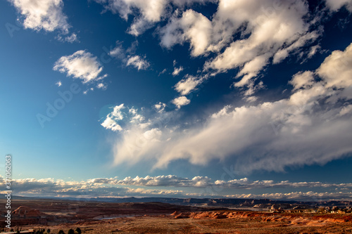 Mostly the sky and the clouds dominate the town under it - Page, AZ, USA