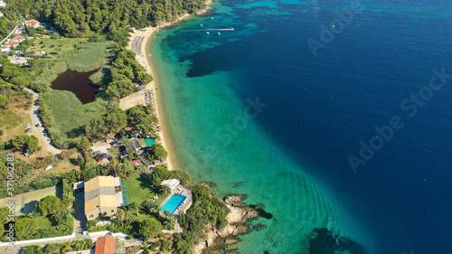 Aerial drone photo of popular paradise turquoise beach of Vromolimnos with small swamp next to it, Skiathos island, Sporades, Greece