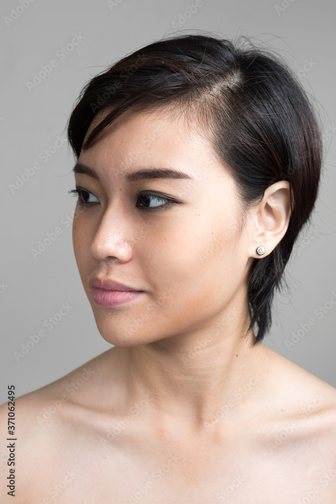 Portrait of young beautiful Asian woman with short hair shirtless Portrait of young beautiful Asian woman with short hair shirtless