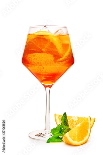 Glass of aperol spritz cocktail with orange slices isolated on white background