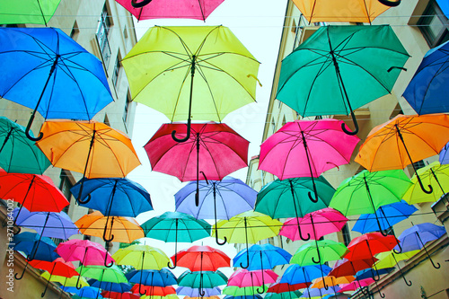 Colored umbrellas hanging at the top. Local landmark © alexmak