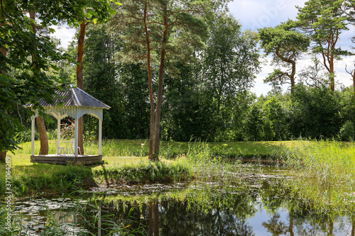 Romantic landscape in Estonia in front of a pond 