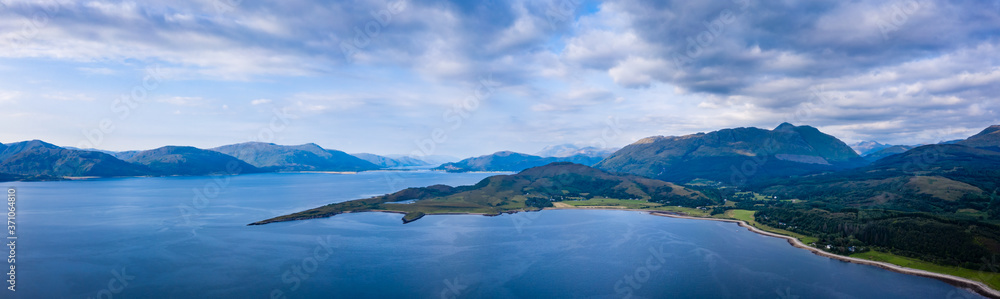 Aerial view of the sound of shuna and shuna island on the west coast of the argyll region of the highlands of Scotland during a summer storm showing a salmon fish farm
