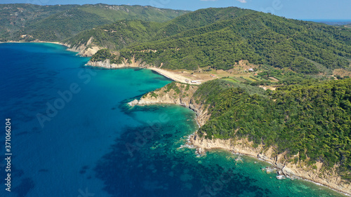Aerial drone photo of paradise emerald and turquoise sandy beach of Aselinos covered in pine trees in island of Skiathos, Sporades, Greece © aerial-drone