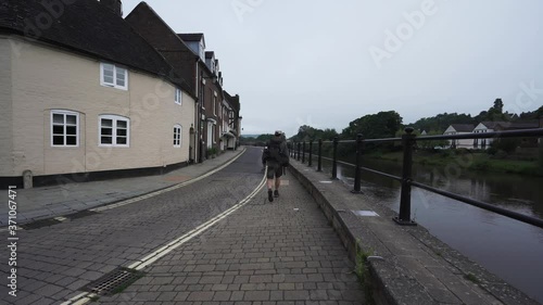 A man walking beside a river in Bewdley UK photo