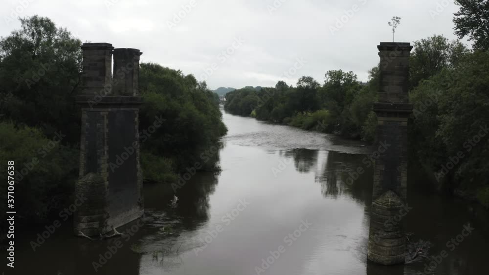 Aerial view of a derelict and destroyed river bridge Aerial view of a derelict and destroyed river bridge