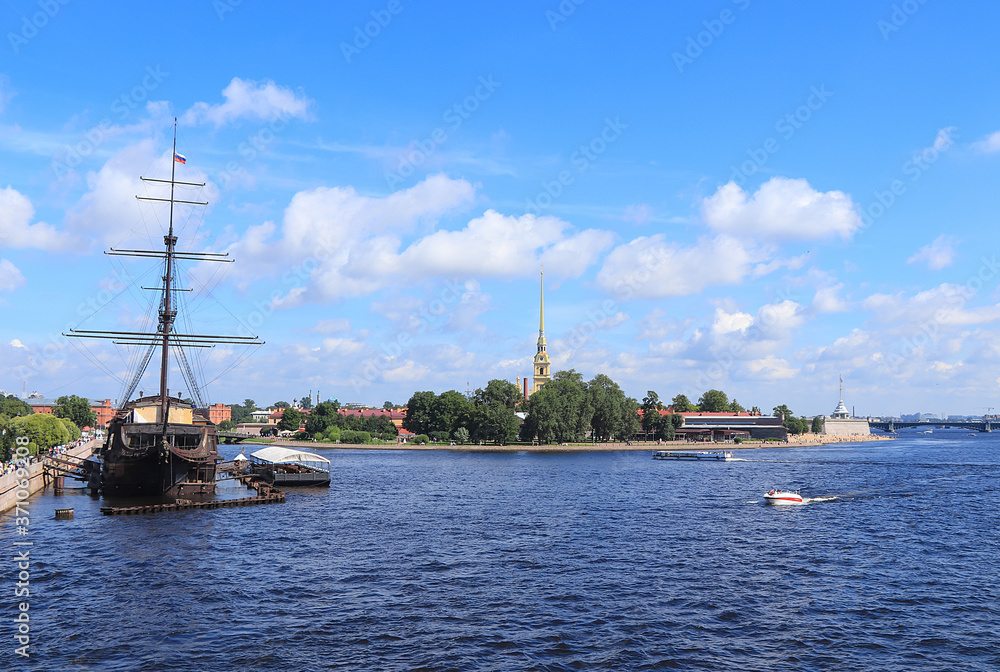 Russia, Saint Petersburg, July 8, 2020, flying Dutchman. In the photo, the ship flying Dutchman and Peter and Paul fortress, view from the Exchange bridge