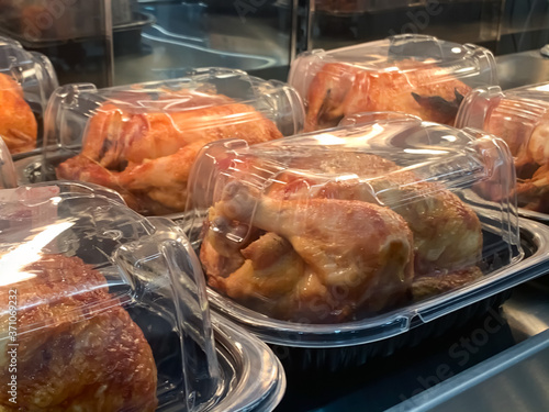 Packed roast chicken place on the shelf waiting to sale