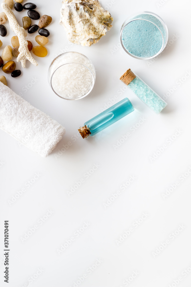 Spa set bar of sea cosmetics - aroma oil and blue salt. Above view Spa set bar of sea cosmetics - aroma oil and blue salt. Above view