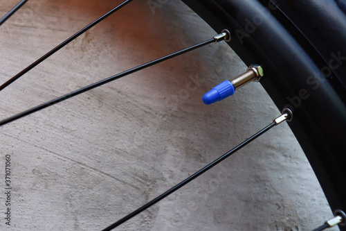 bicycle wheel close-up, camera npeller with blue cap
