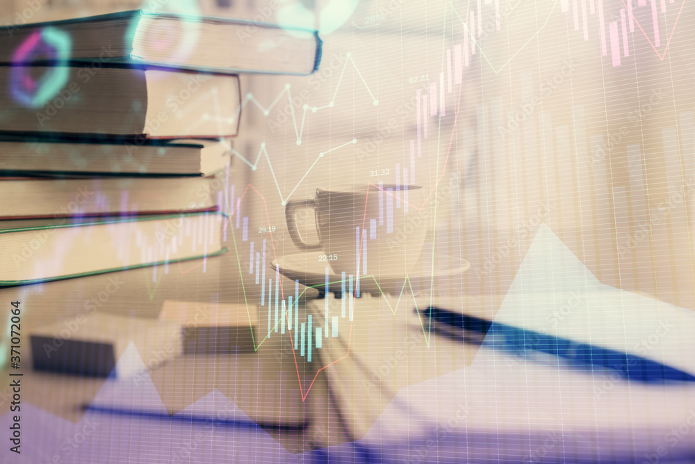 Naklejka premium Double exposure of financial chart drawing and desktop with coffee and items on table background. Concept of forex market trading
