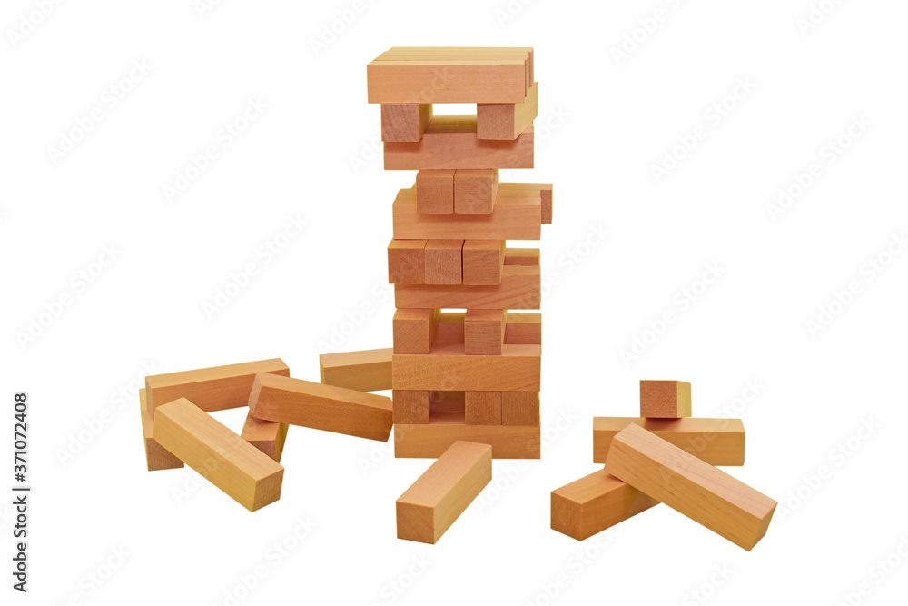 Ruined tower made of brown rectangular bars. Board game Jenga Tower made of wooden blocks. A game of skill, logic and coordination. Balance. Close-up. Isolation on a white background. Ruined tower made of brown rectangular bars. Board game Jenga Tower made of wooden blocks. A game of skill, logic and coordination. Balance. Close-up. Isolation on a white background.