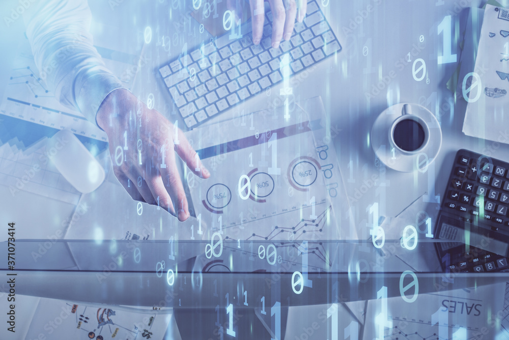 Double exposure of man's hands typing over computer keyboard and data theme hologram drawing. Top view. Technology concept. Double exposure of man's hands typing over computer keyboard and data theme hologram drawing. Top view. Technology concept.