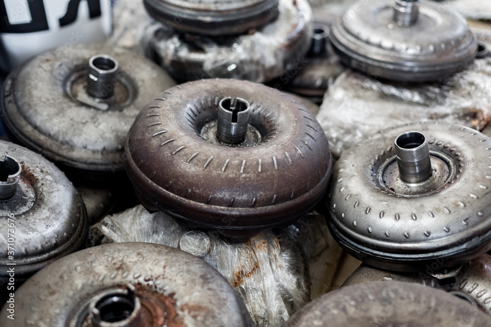 Lots of old torque converter close up. Automatic transmission repair workshop..