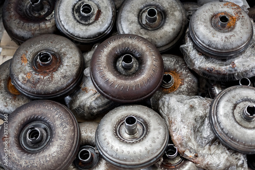 Lots of old torque converter close up. Automatic transmission repair workshop..