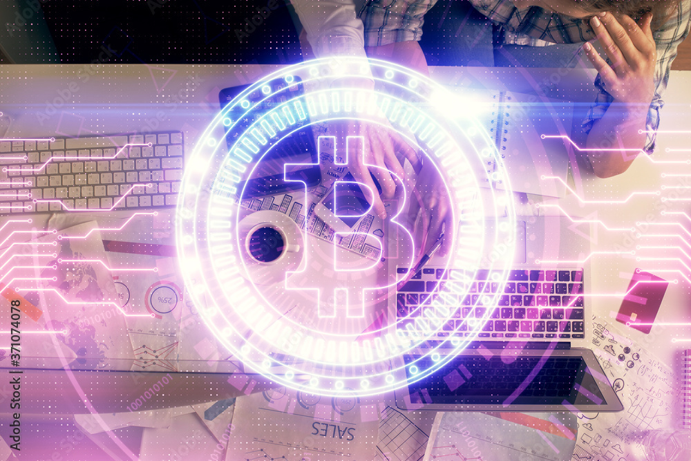 Double exposure of man and woman working together and crypto theme hologram drawing. Computer background. Blockchain concept. Top View. Double exposure of man and woman working together and crypto theme hologram drawing. Computer background. Blockchain concept. Top View.